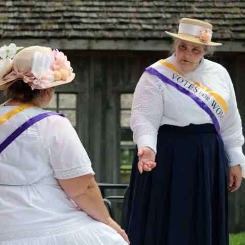 two ladies in historical outfits